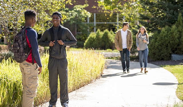 Students outside Founders Hall south entrance