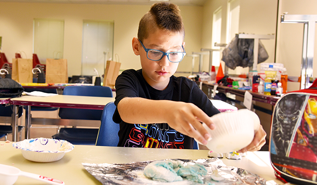 Student doing experiment during Camp Westly