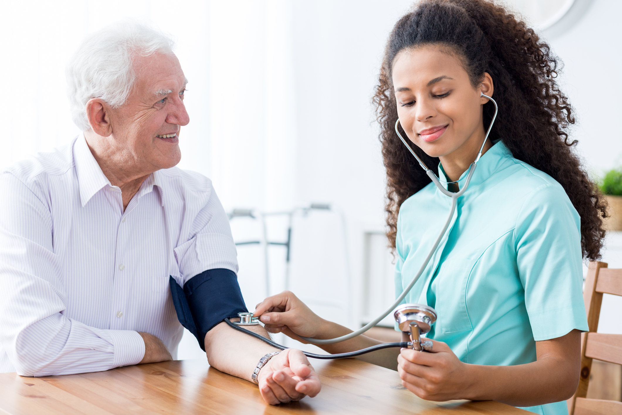 Nurse Aide with patient in hospital