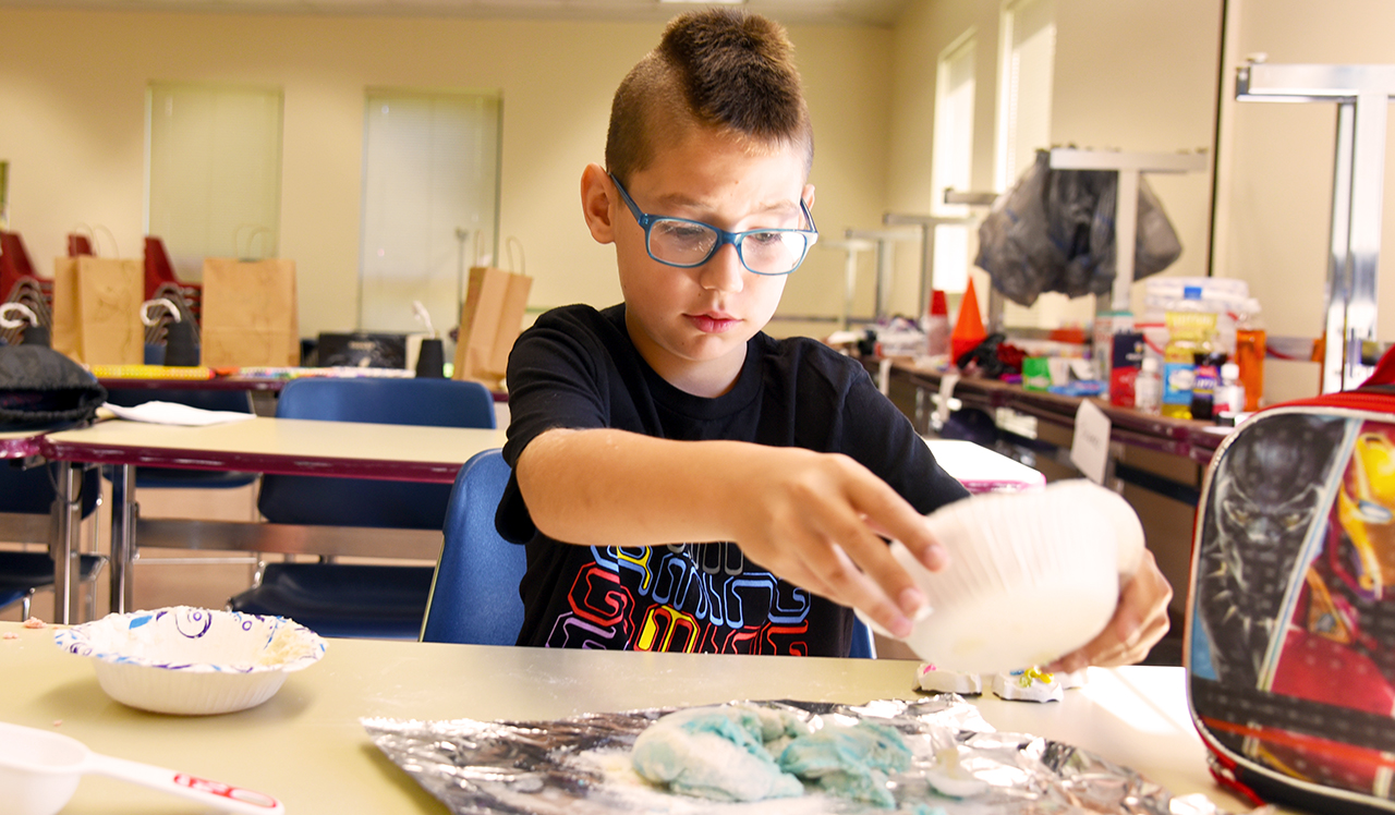 Student doing experiment at Camp Westly
